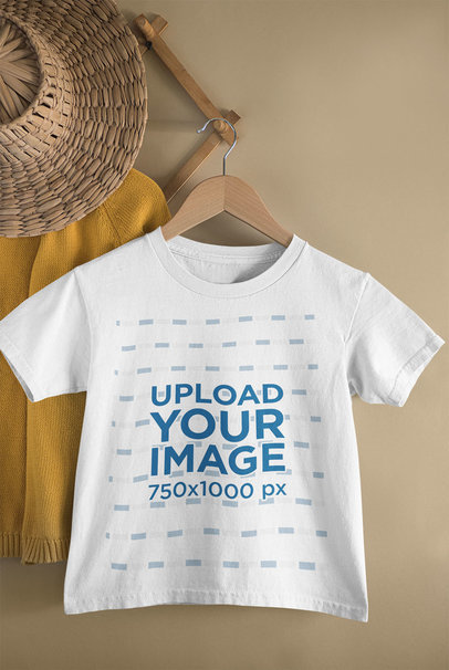 Mockup of a Kid's T-Shirt Hanging from a Wall Rack 33736