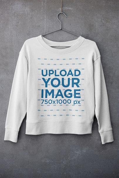 Mockup of a Sweatshirt Hanging Against a Concrete Surface