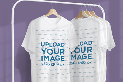 Mockup Featuring Two Customizable T-Shirts Hanging From a Metal Clothing Rack 3730-el1