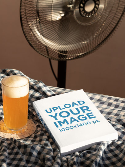 Mockup of a Book Lying Next to a Glass of Beer 33911
