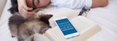 Mockup of an iPhone Over a Book Featuring a Woman Sleeping 12800wide