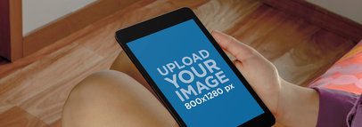 Mockup of a Woman Holding Nexus 7 over Her Knees