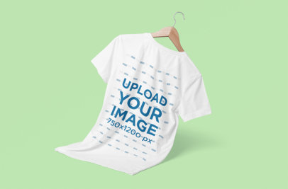 Minimal T-Shirt Mockup Featuring a Wooden Hanger and a Colored Backdrop
