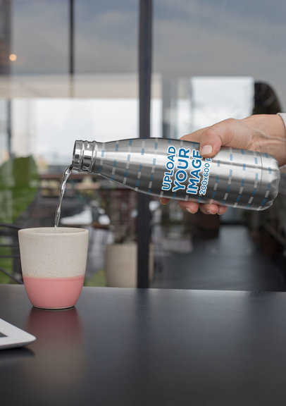 Mockup of Someone Pouring Water From an Aluminum Bottle 33532