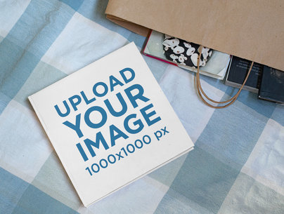 Mockup of a Square Hardcover Book in a Casual Setting