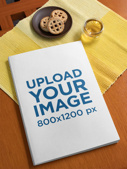 Mockup of a Book Lying Next to a Plate with Cookies 33656