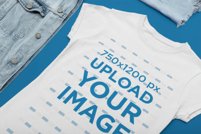 Mockup of a Women's T-Shirt Laid Flat Next to Some a Denim Garment 33949