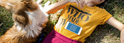 iPhone Mockup of a Woman Lying in the Grass with Her Dog