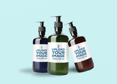Mockup Featuring Three Hand Sanitizer Bottles Against a Solid Color Background 