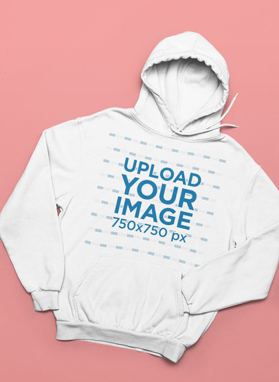 Mockup of a Pullover Hoodie Placed on a Customizable Surface