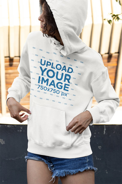 Mockup of a Young Woman Wearing a Pullover Hoodie