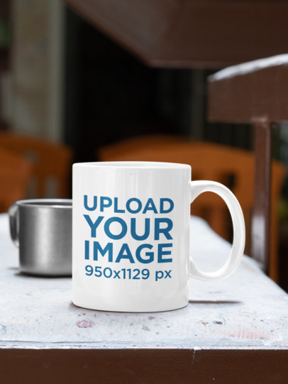 Mockup of an 11 oz Coffee Mug Placed on a Concrete Table 