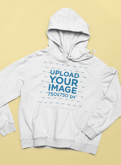 Mockup of a Pullover Hoodie Lying over a Flat Surface
