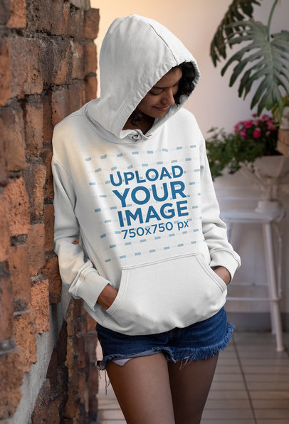 Mockup of a Joyful Woman Wearing a Customizable Pullover Hoodie 