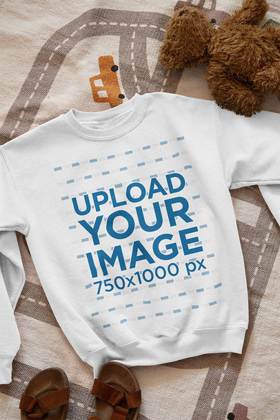 Mockup of a Sweatshirt Lying on a Children's Bedroom Floor 33994