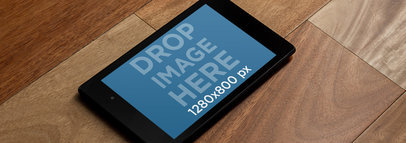 Mockup of a Nexus 7 in Landscape Position on a Wooden Surface