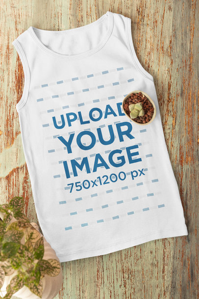Flat Lay Mockup of a Tank Top Featuring a Small Plant