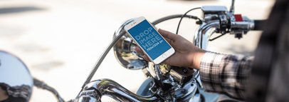 Mockup of a Guy on his Motorcycle Checking his iPhone 6s Before a Ride a12935w