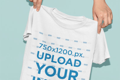 Mockup of a T-Shirt Suspended by a Couple of Hands 33925