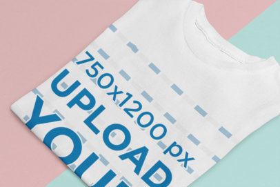 Mockup of a Folded T-Shirt on a Two-Color Surface