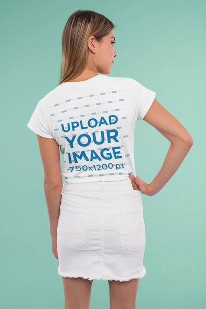 Back-View Mockup of a Young Woman Wearing a T-Shirt in a Studio