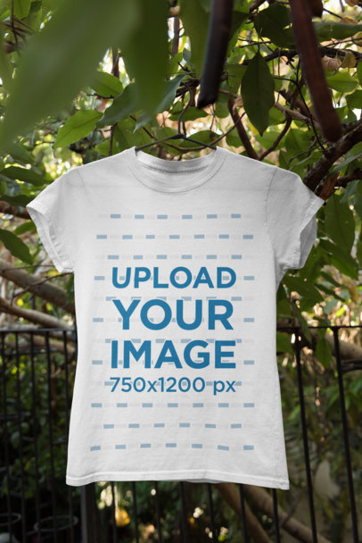 Mockup Featuring a Crew Neck T-Shirt Hanging From a Tree 