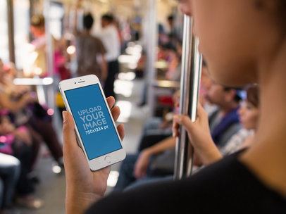 iPhone in Portrait Position Mockup of a Woman Riding the Subway in the Morning a12658