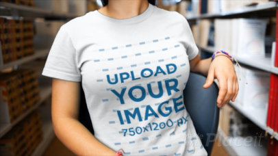 Video of a Woman Wearing a T-Shirt at a Library