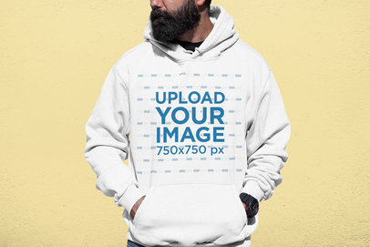 Cropped Face Mockup of a Bearded Man with a Hoodie at a Studio