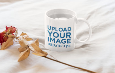 Mockup of an 11 oz Coffee Mug Next to a Dried Rose 