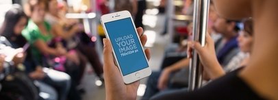 Mockup of an iPhone Featuring a Woman in the Subway with People in the Background