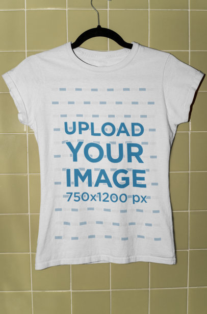 Mockup of a Women's T-Shirt Mockup Hanged on a Tiled Wall