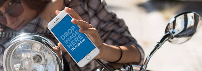 Young Woman on a Motorcycle Showing her iPhone 6s in Portrait Position Mockup