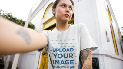 Selfie Video of a Tattooed Woman Wearing a Crewneck T-Shirt