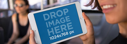 Mockup of a Woman Using her iPad Mini on the Bus 12956a