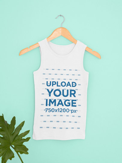 Mockup Featuring a Customizable Tank Top Hanging by a Green Leaf 33844