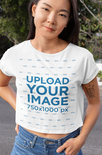 Crop Top Mockup of a Young Woman with an Arm Tattoo