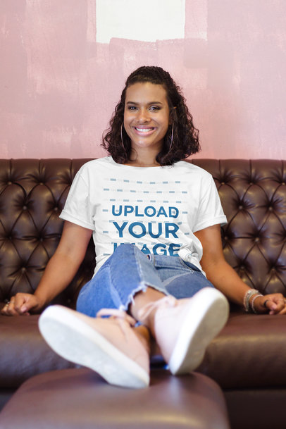 T-Shirt Mockup Featuring a Smiling Woman on a Couch 3840-el1