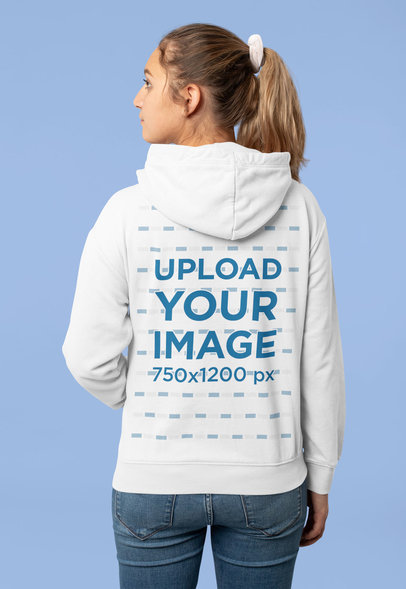 Mockup of a Woman with a Ponytail Wearing a Hoodie at a Studio