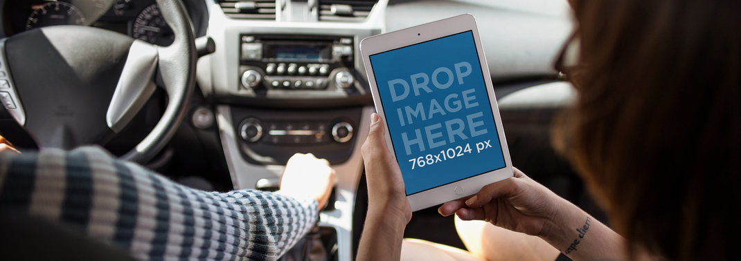 iPad Mini Mockup of a Woman Riding in the Passenger's Seat with her Boyfriend