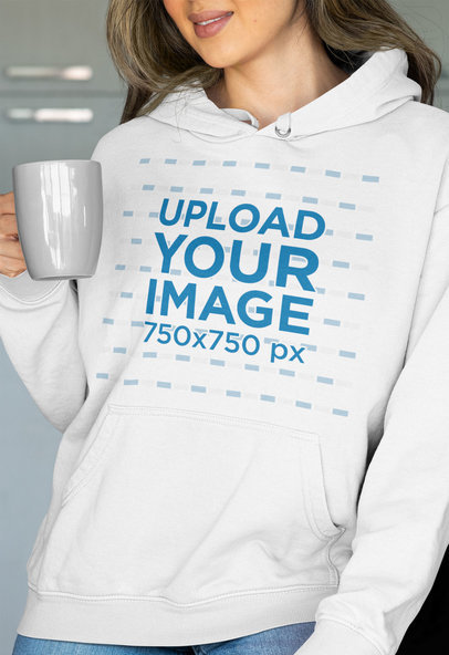Pullover Hoodie Mockup of a Woman Holding Her Beverage