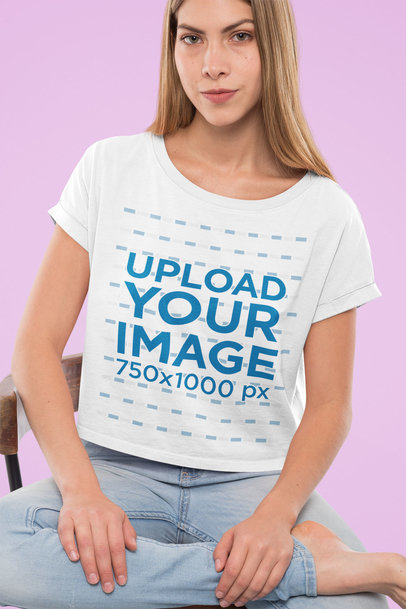 Crop Top T-Shirt Mockup of a Woman Sitting on a Chair