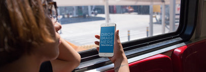 iPhone 6s Mockup in a Woman's Hand Who is Riding the Bus Home