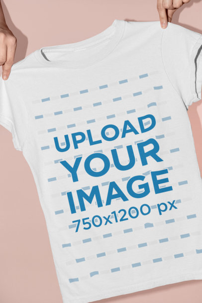 Mockup of Someone Holding a Women's T-Shirt
