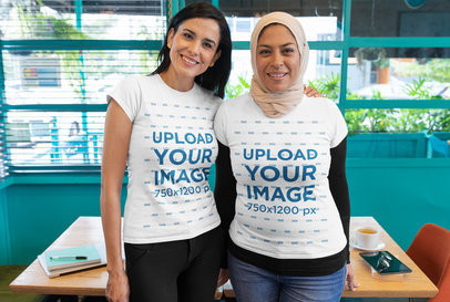 T-Shirt Mockup Featuring Two Adult Women Posing at a Restaurant 32072
