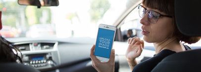Hipster Girl Riding in the Passenger's Seat of a Car Checking her iPhone 6 Mockup a12941wide