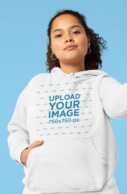 Mockup of a Serious Young Woman with a Hoodie Taking a Selfie 