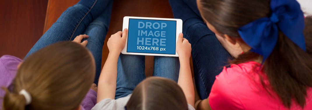 Mockup Featuring Three Young Girls Using an iPhone in Landscape Position