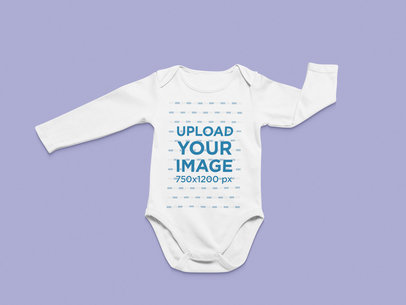 Flat Lay Mockup of a Long Sleeve Onesie in a Minimalist Setting