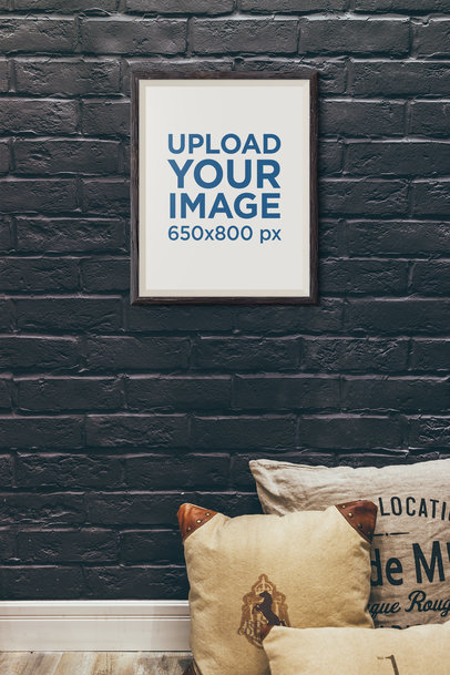 Mockup of an Art Print Hanging on a Black Wall 